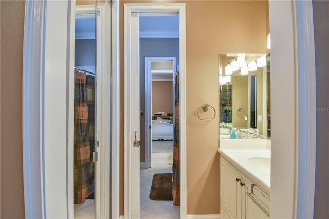 bathroom with tile patterned floors, curtained shower, crown molding, and vanity