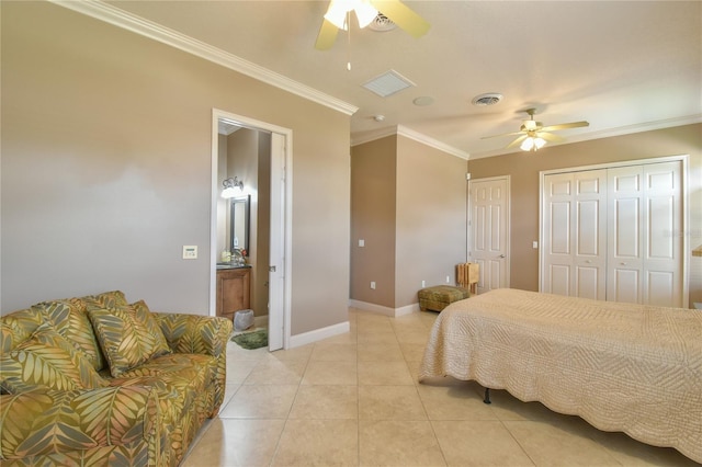 tiled bedroom with ceiling fan and ornamental molding