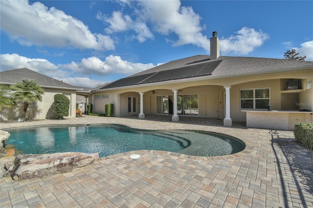 view of pool featuring ceiling fan and a patio