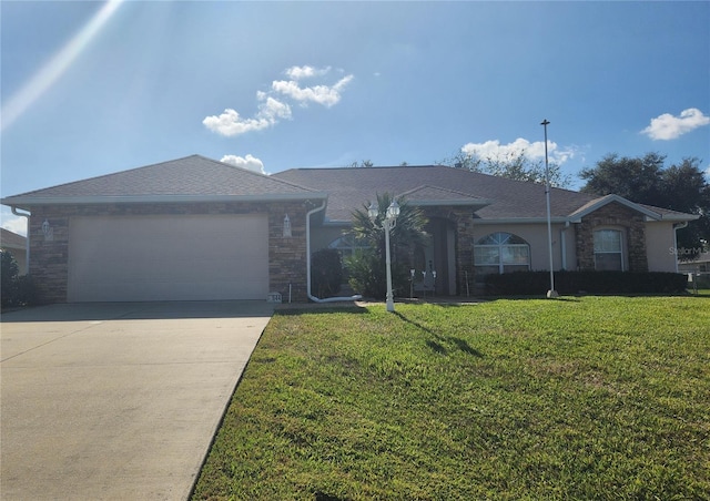 ranch-style home with a front yard and a garage