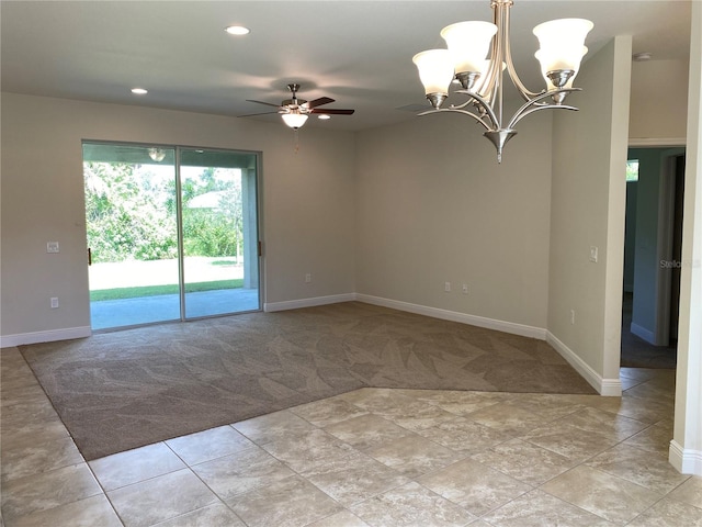 unfurnished room with ceiling fan with notable chandelier and light colored carpet