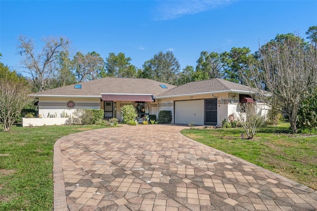 ranch-style home with a front yard and a garage