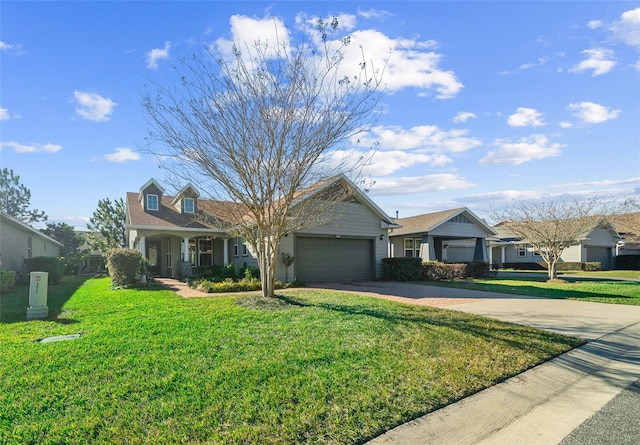 view of front facade with a front lawn and a garage