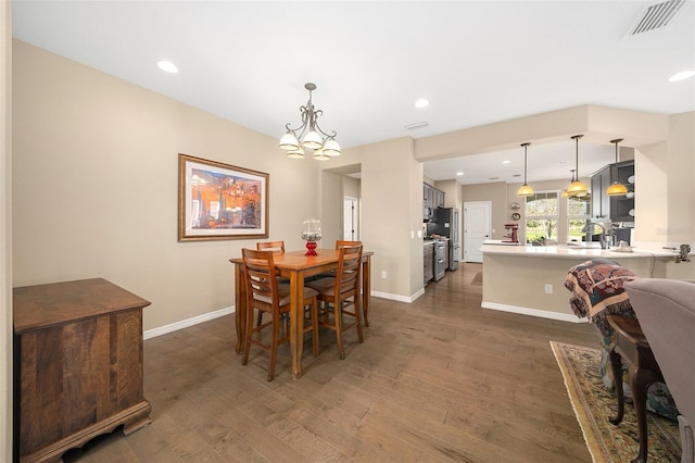 dining room with dark wood-type flooring and sink