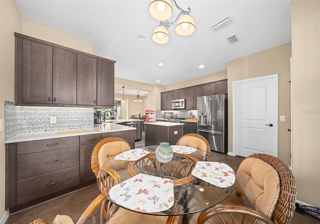 dining space featuring dark hardwood / wood-style flooring