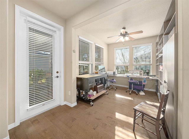 sunroom / solarium with ceiling fan