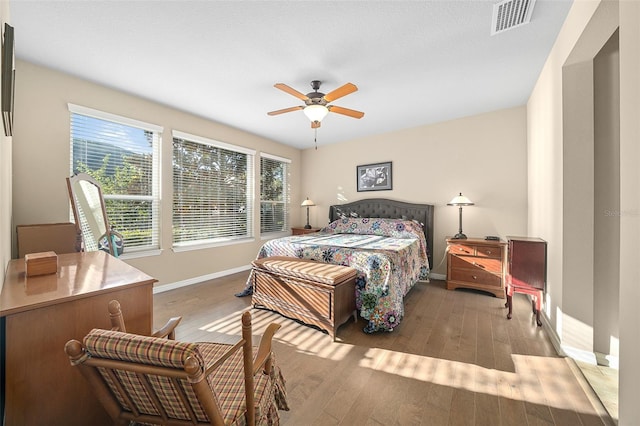 bedroom with ceiling fan and light wood-type flooring