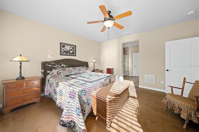 bedroom with dark hardwood / wood-style floors and ceiling fan