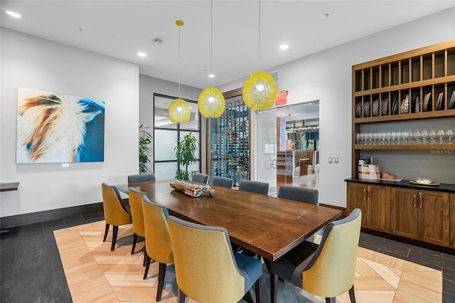 dining area featuring bar area