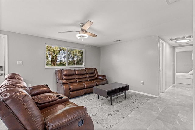 living room featuring light tile flooring and ceiling fan