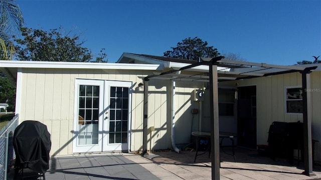 rear view of property with french doors and a patio area