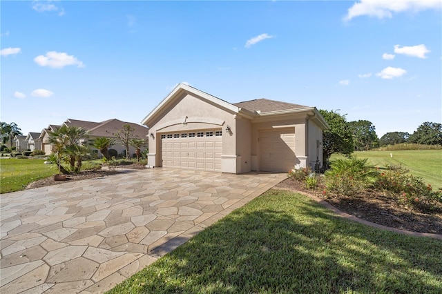 single story home with a front yard and a garage