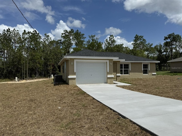 ranch-style home featuring a garage and a front lawn