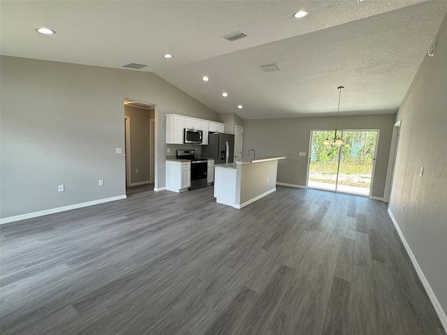 kitchen featuring dark hardwood / wood-style flooring, decorative light fixtures, stainless steel appliances, and white cabinets