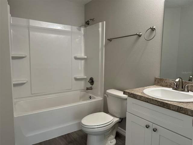 full bathroom with vanity, wood-type flooring, shower / tub combination, and toilet