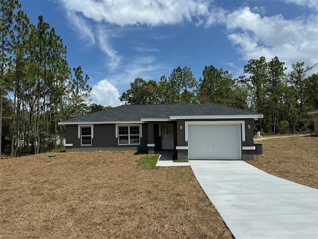 ranch-style home featuring a garage and a front yard