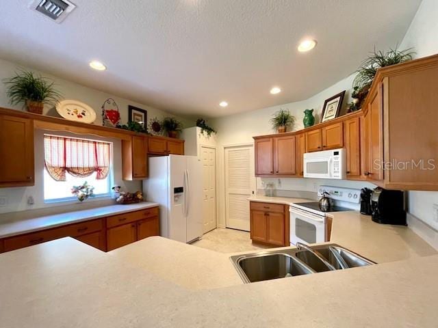 kitchen with sink and white appliances