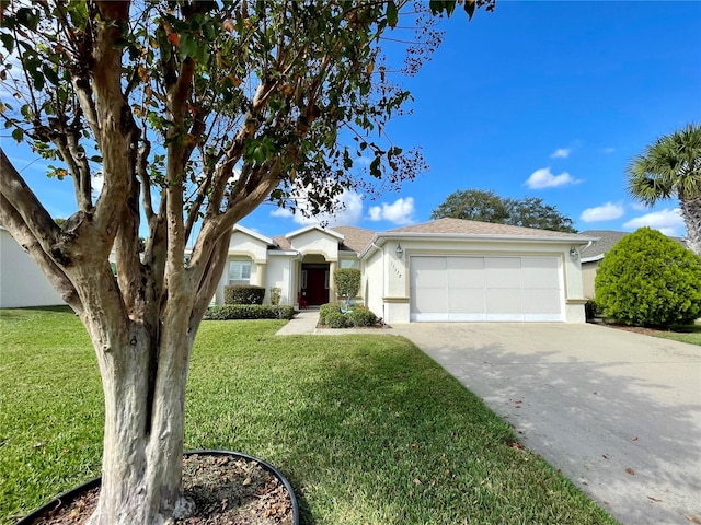 single story home featuring a garage and a front yard