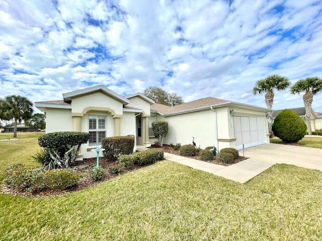 view of front facade with a garage and a front lawn