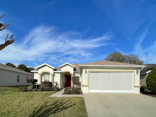 ranch-style house with a garage and a front lawn