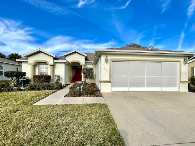 ranch-style house with a garage and a front yard