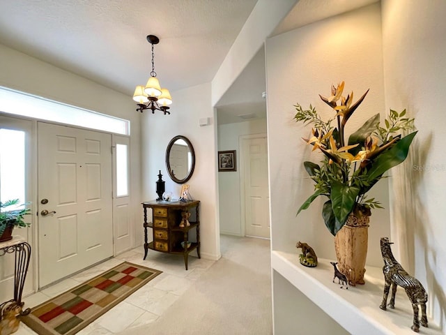 foyer with a notable chandelier