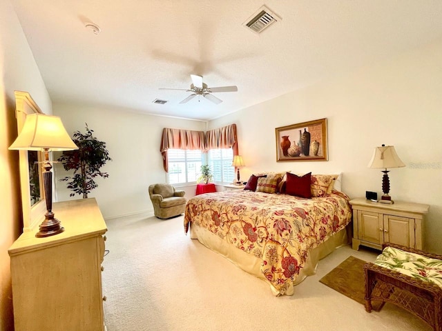 bedroom with light colored carpet and ceiling fan