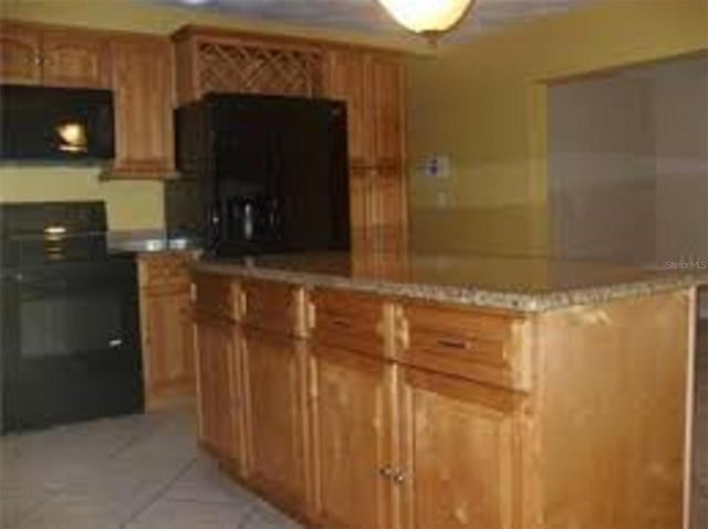 kitchen featuring range and a center island