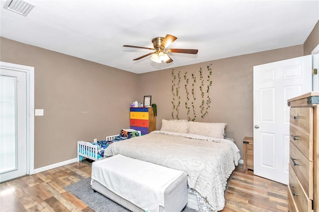 bedroom featuring dark hardwood / wood-style floors and ceiling fan