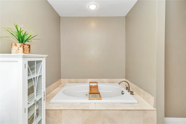 bathroom with tiled bath