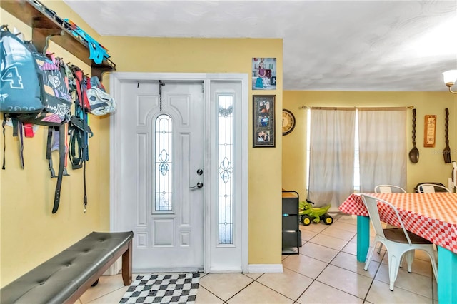 foyer featuring light tile floors