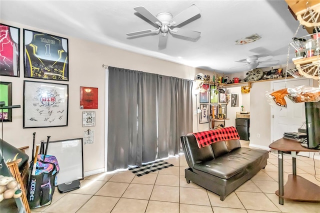 tiled living room featuring ceiling fan