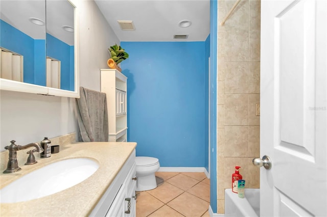 full bathroom featuring toilet, tile flooring, tiled shower / bath combo, and oversized vanity