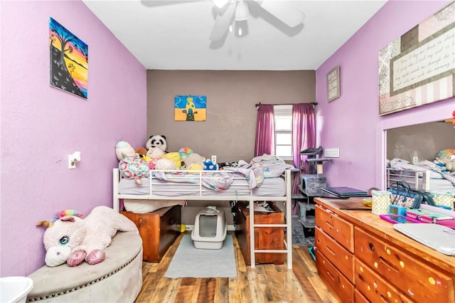 bedroom featuring ceiling fan and light wood-type flooring