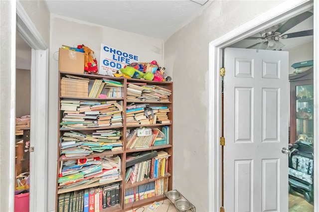 interior space featuring ceiling fan