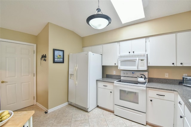 kitchen with white appliances, pendant lighting, a skylight, light tile flooring, and white cabinetry