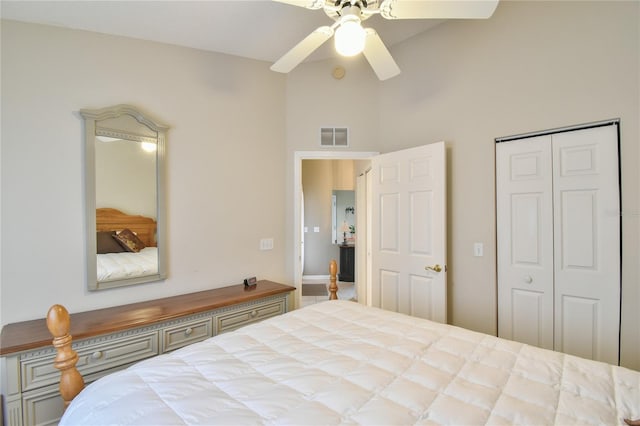 carpeted bedroom with high vaulted ceiling and ceiling fan