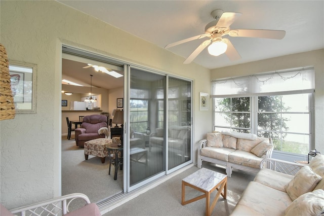 sunroom / solarium with vaulted ceiling and ceiling fan