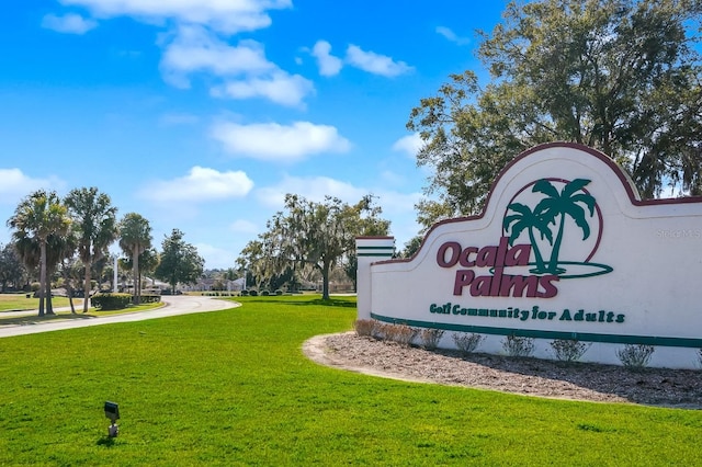 community sign with a yard