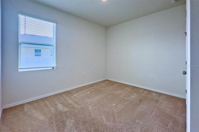 empty room featuring carpet floors