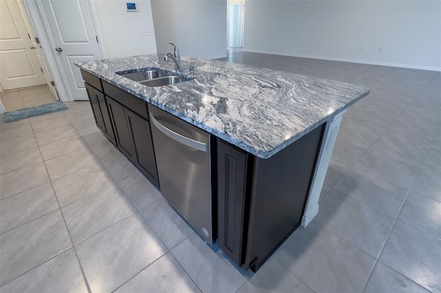 kitchen with sink, an island with sink, light tile flooring, and dishwasher