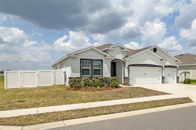 view of front of home with a garage and a front yard