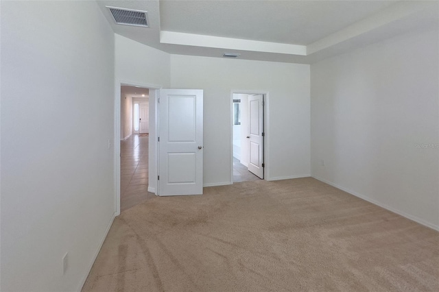 unfurnished room with light carpet