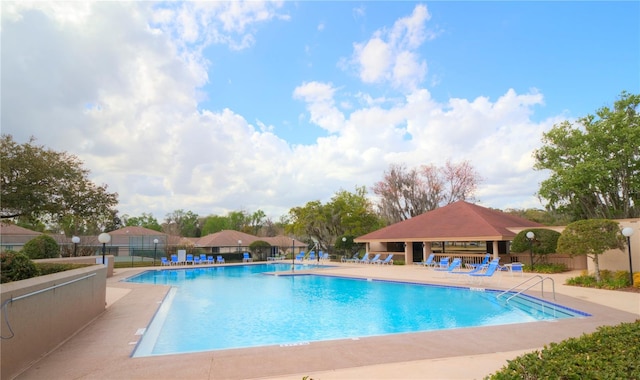 view of swimming pool featuring a patio area