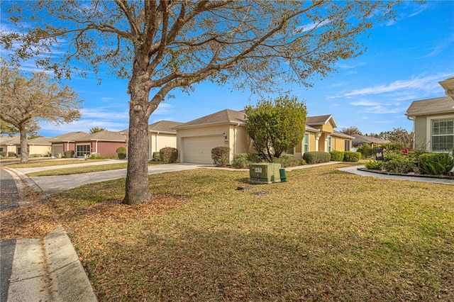 view of front of home with a garage and a front lawn