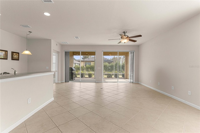 interior space with ceiling fan