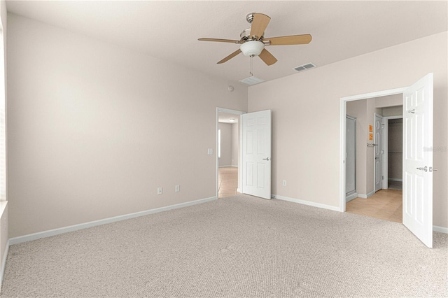 unfurnished bedroom with light colored carpet and ceiling fan