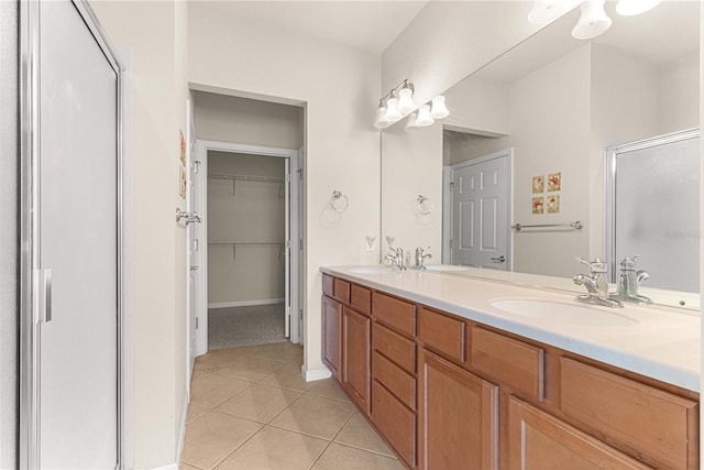 bathroom featuring tile patterned floors and dual bowl vanity