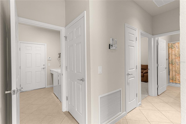 hallway with light tile patterned floors