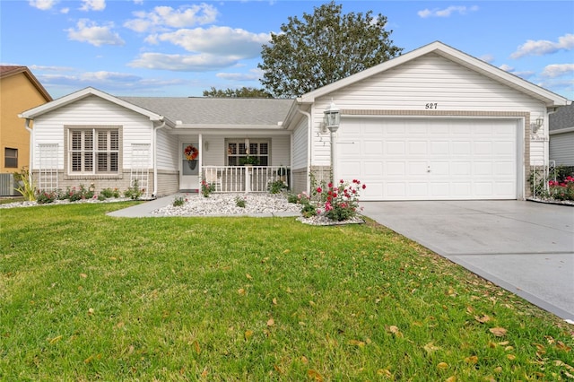 ranch-style home with a front yard and a garage